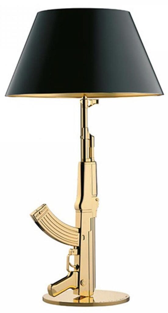 Lampe de table Gun or / doré de Philippe Starck chez Flos